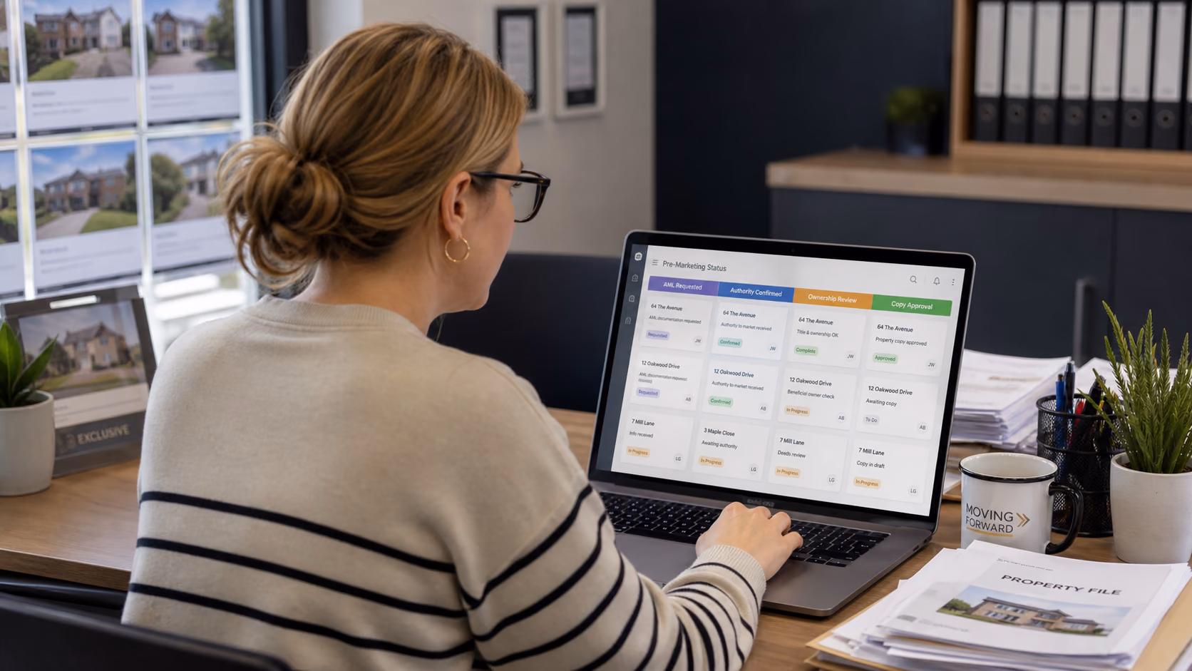 A branch administrator checking a pre-marketing status board with AML requested, authority confirmed, ownership review, and copy approval columns