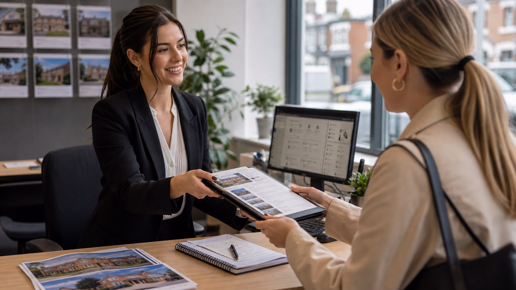 Two estate agents handing over a live property file with viewing notes, offer status, and next actions before one leaves the office